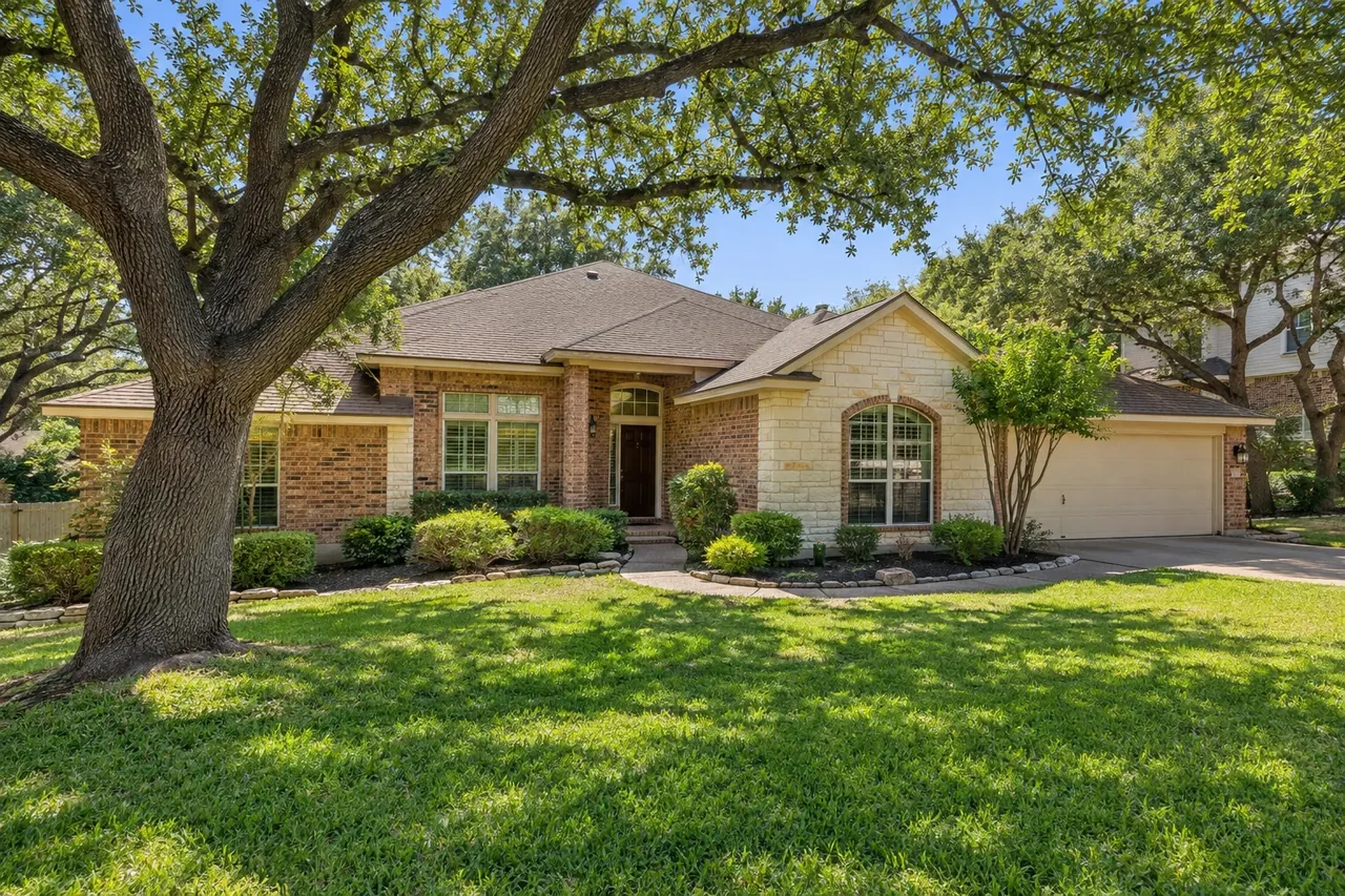 Brick home on a sloping lot in Brushy Creek