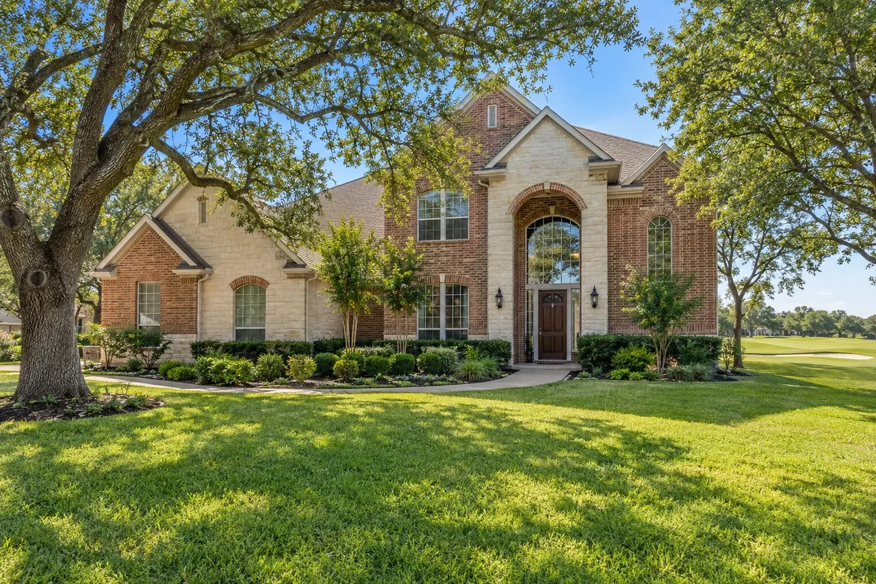 Late-1990s brick home on a Forest Creek golf course lot