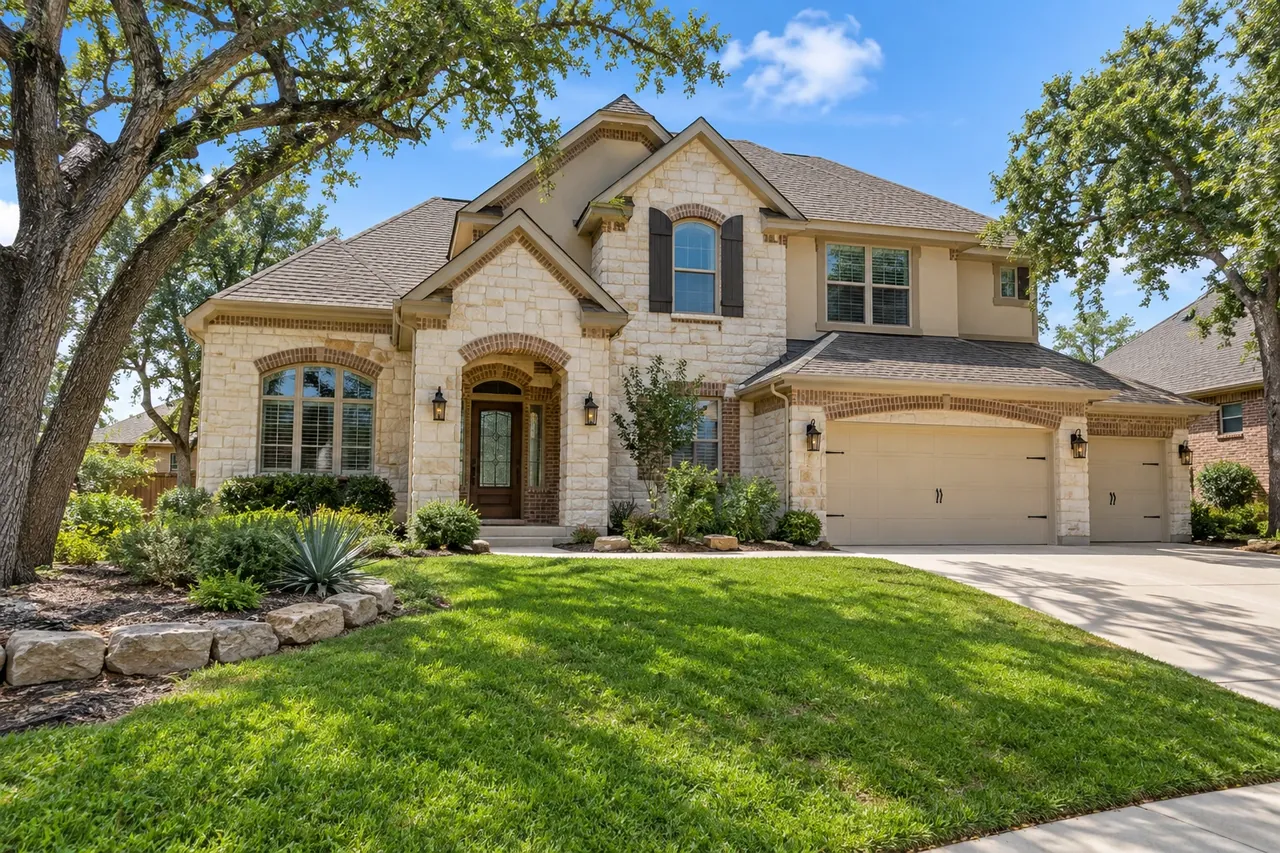 Newer stone-front home on a sloping Mayfield Ranch lot