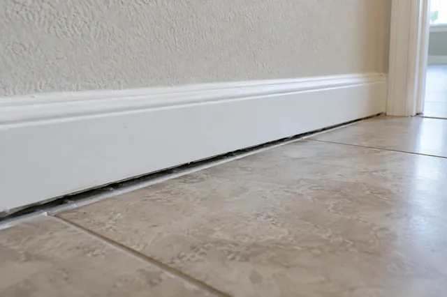 Trim pulling away from the floor or ceiling as the slab drops or heaves.