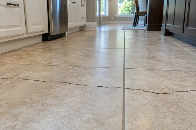 A crack that runs across several tiles often follows a crack in the slab below.