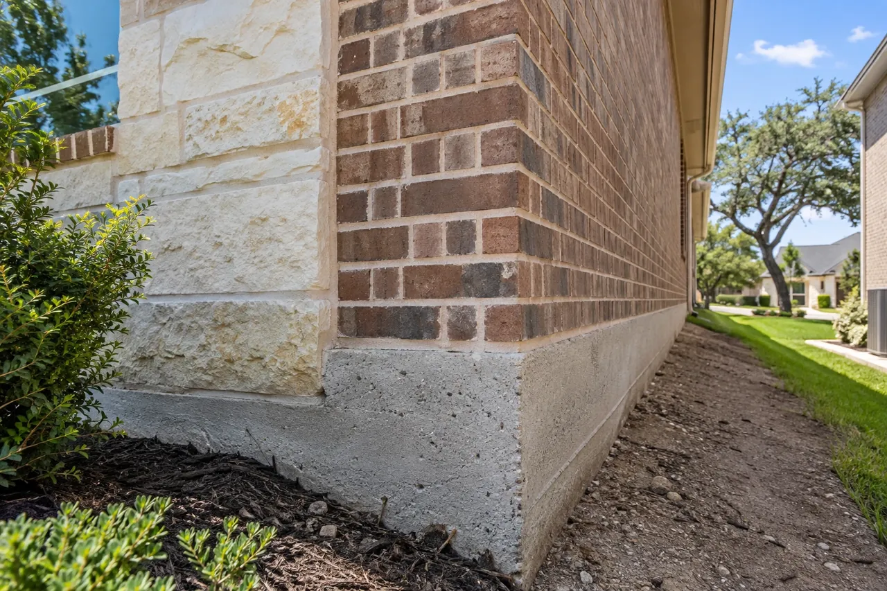 Gap between dry clay soil and a slab grade beam at a Round Rock home